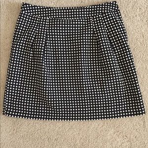 Black and white polka dot skirt.